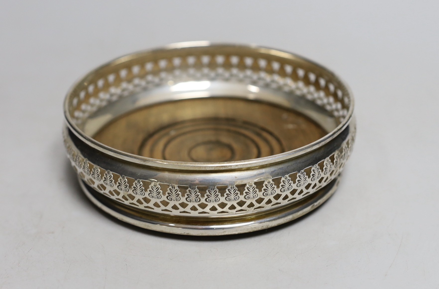 A modern pierced silver mounted wine coaster, A. Chick & Sons Ltd, London, 1970, diameter 13.3cm.